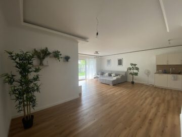 #IMMOTIONAL - NEUBAUWOHNUNG MIT GARTENANTEIL IN BAD BEDERKESA - Wohnzimmer