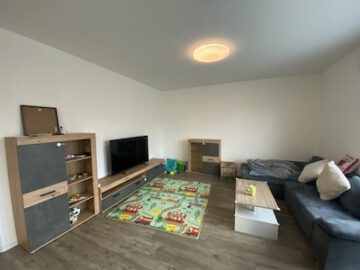 #IMMOTIONAL NEUBAUWOHNUNG MIT BALKON IN NEUENWALDE - Wohnzimmer